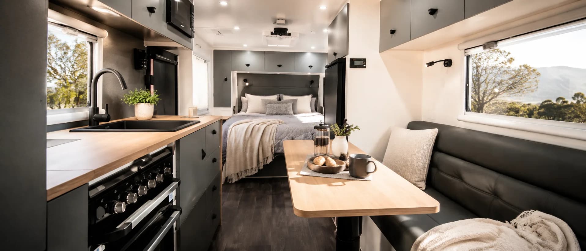 Inside a Canyon — kitchen, dinette and queen bed in warm afternoon light