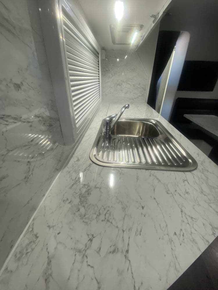 Classic — Stainless sink, full-height splashback