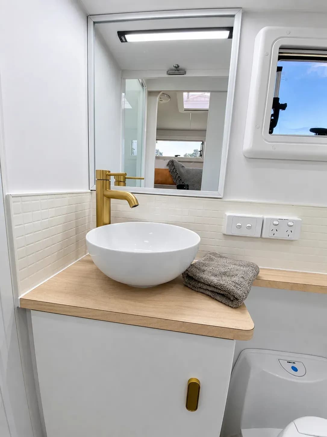 Ensuite — gold tall mixer with white vessel basin