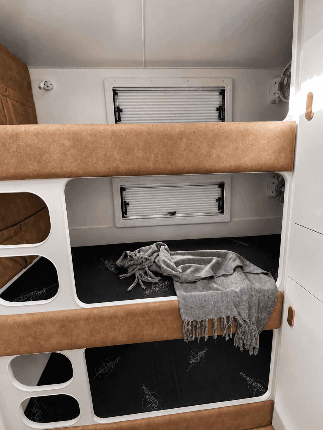 Classic Gold — triple bunks at sunset